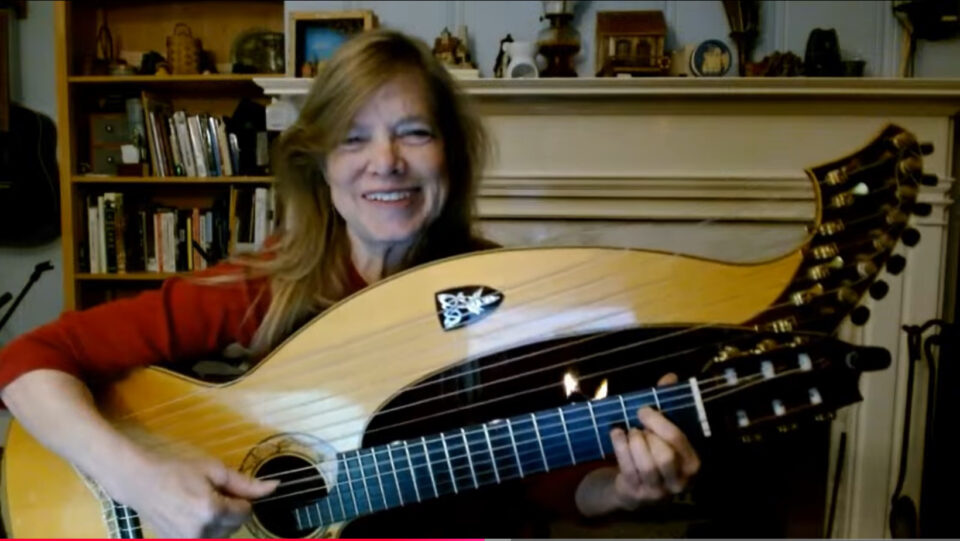 Harp guitar fireplace red shirt